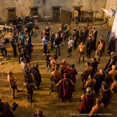 Stunt performers prepare for a fight scene