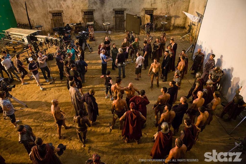 Stunt performers prepare for a fight scene