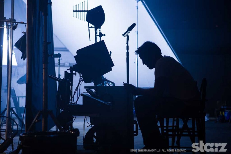 Director Rick Jacobson prepares for the next scene
