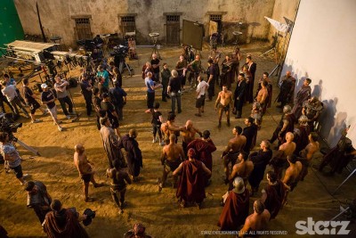 Stunt performers prepare for a fight scene